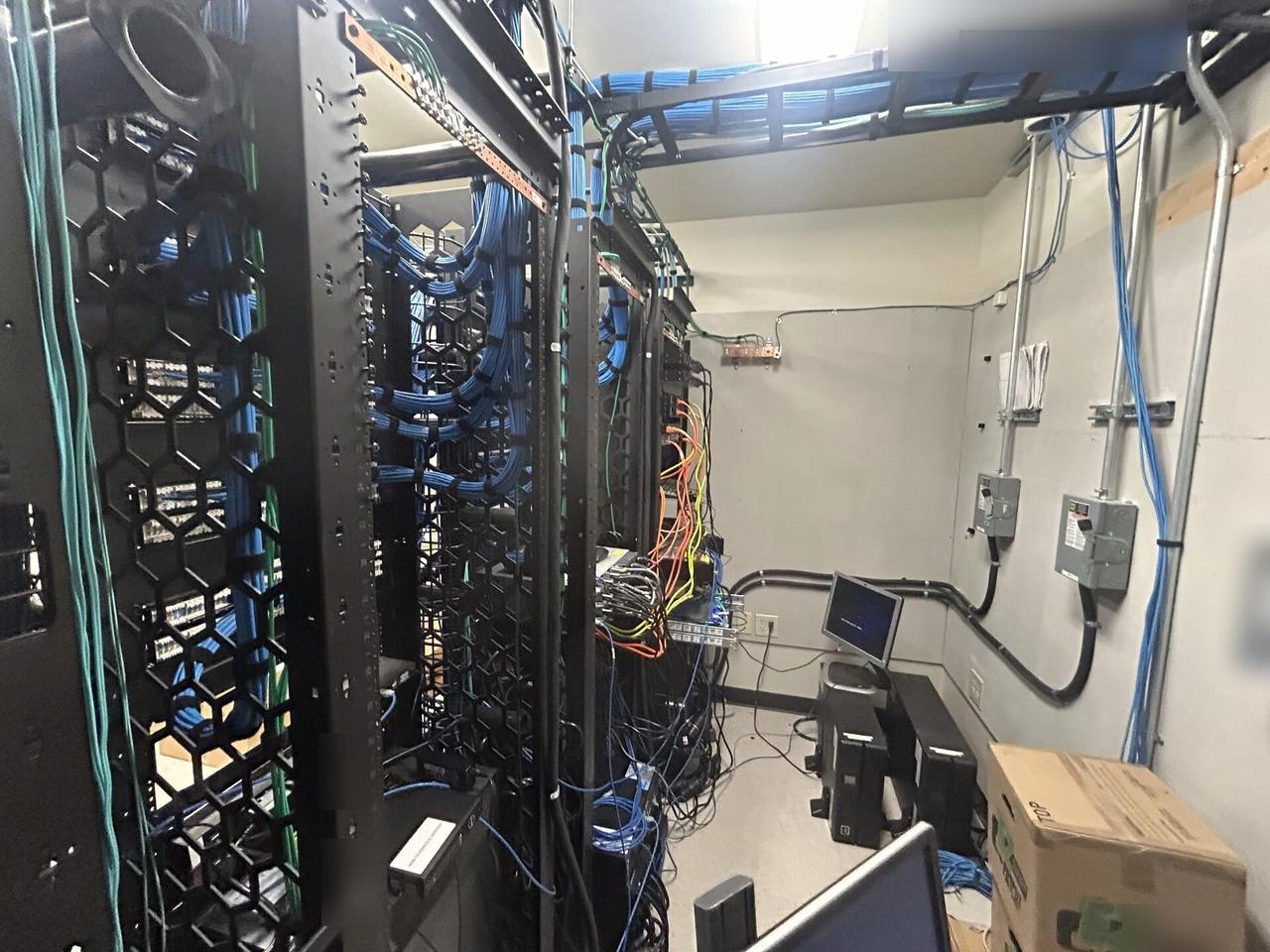 Alrty field photo with equipment cabinet cabling and switch handoff with rack cabling organized