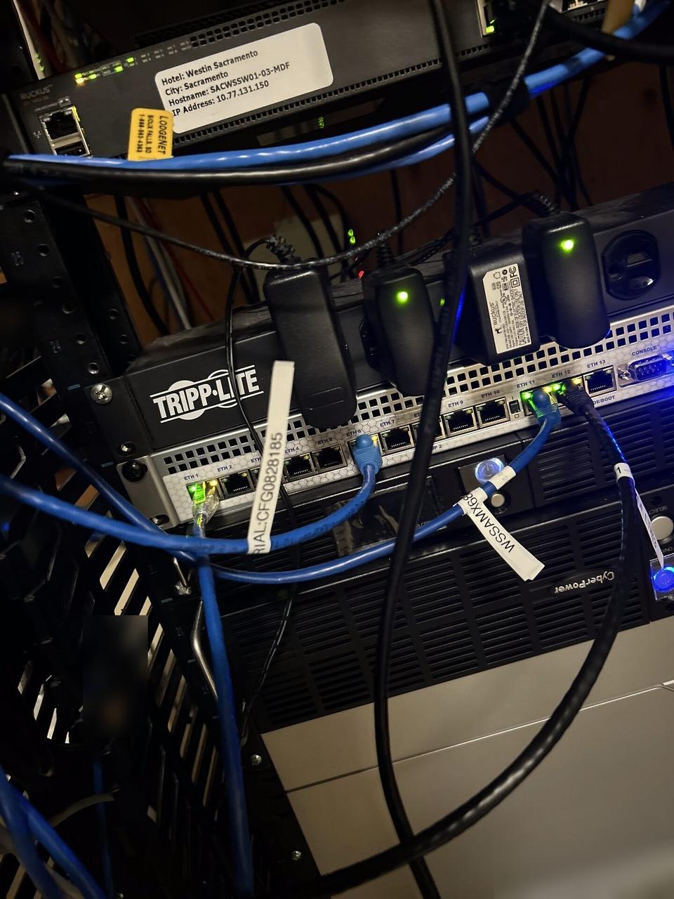 Service documentation showing structured cabling inside a network rack during network hardware support