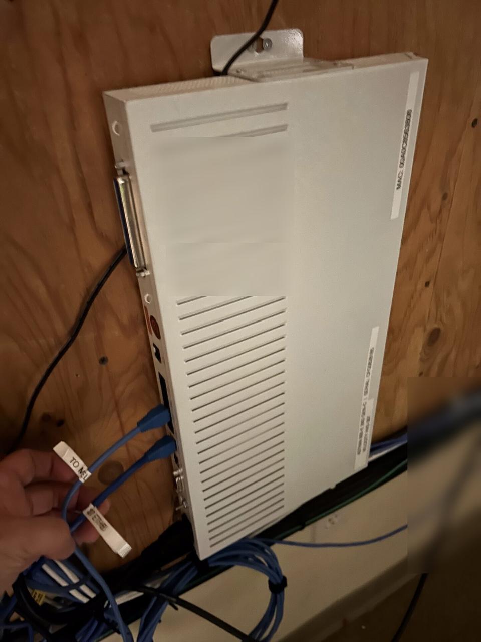 Onsite service photo showing server-room cabinet and structured network equipment before final connectivity checks