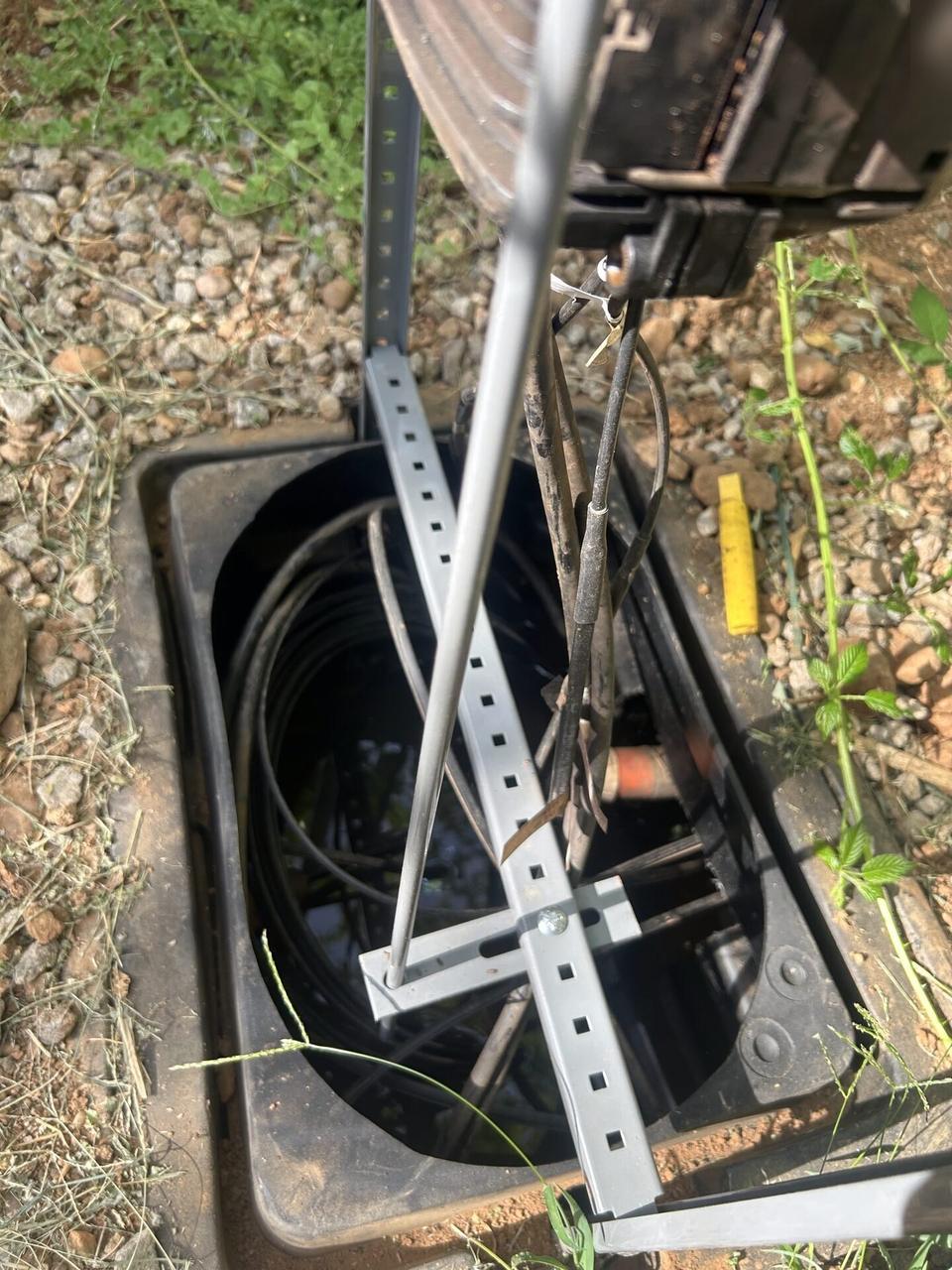 Outdoor fiber distribution unit for customer drops with cable handling visible documented for a smart technology service call