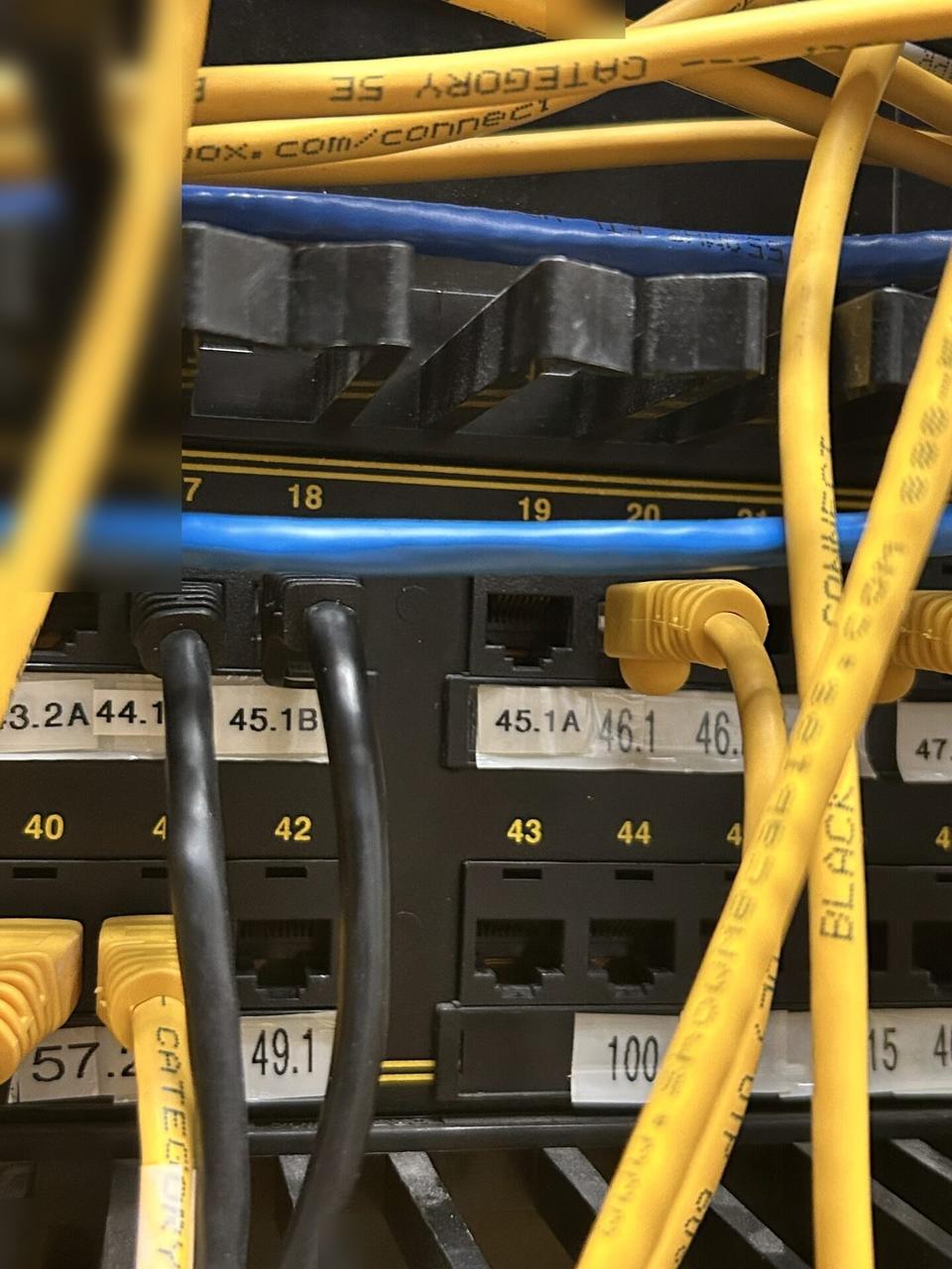 Alrty field photo with low-voltage hardware and device cabling during cable path verification