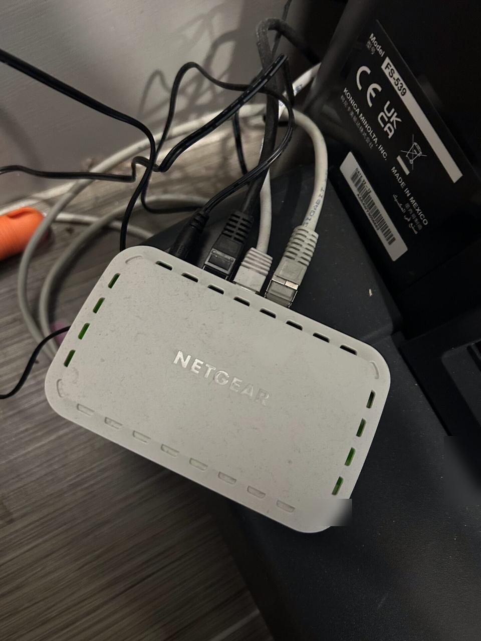 Real router and low-voltage cable handoff photo for internet equipment planning
