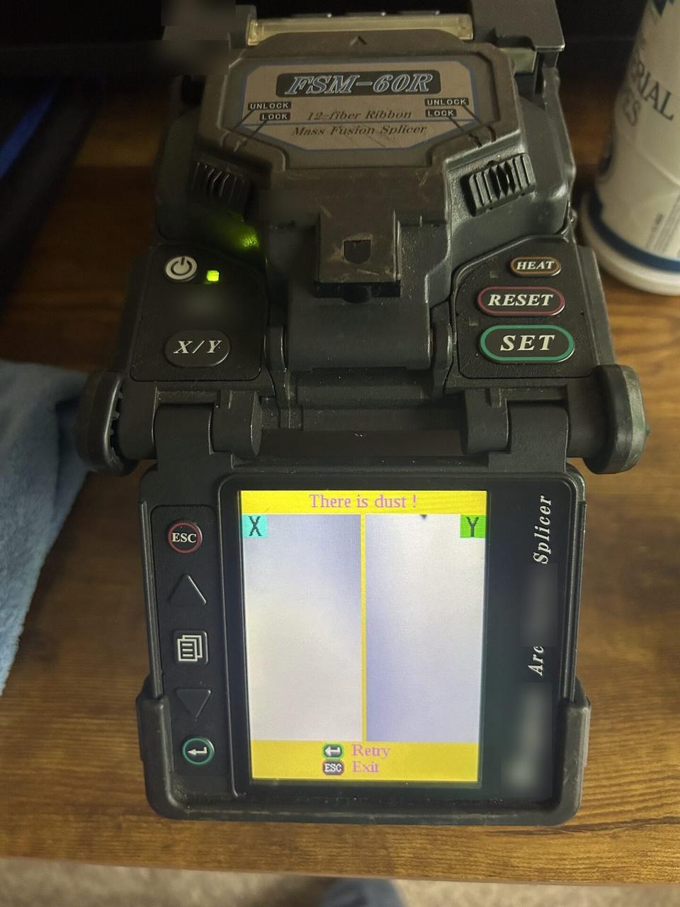 Public-safe portfolio image of optical network equipment during onsite service during fiber preparation