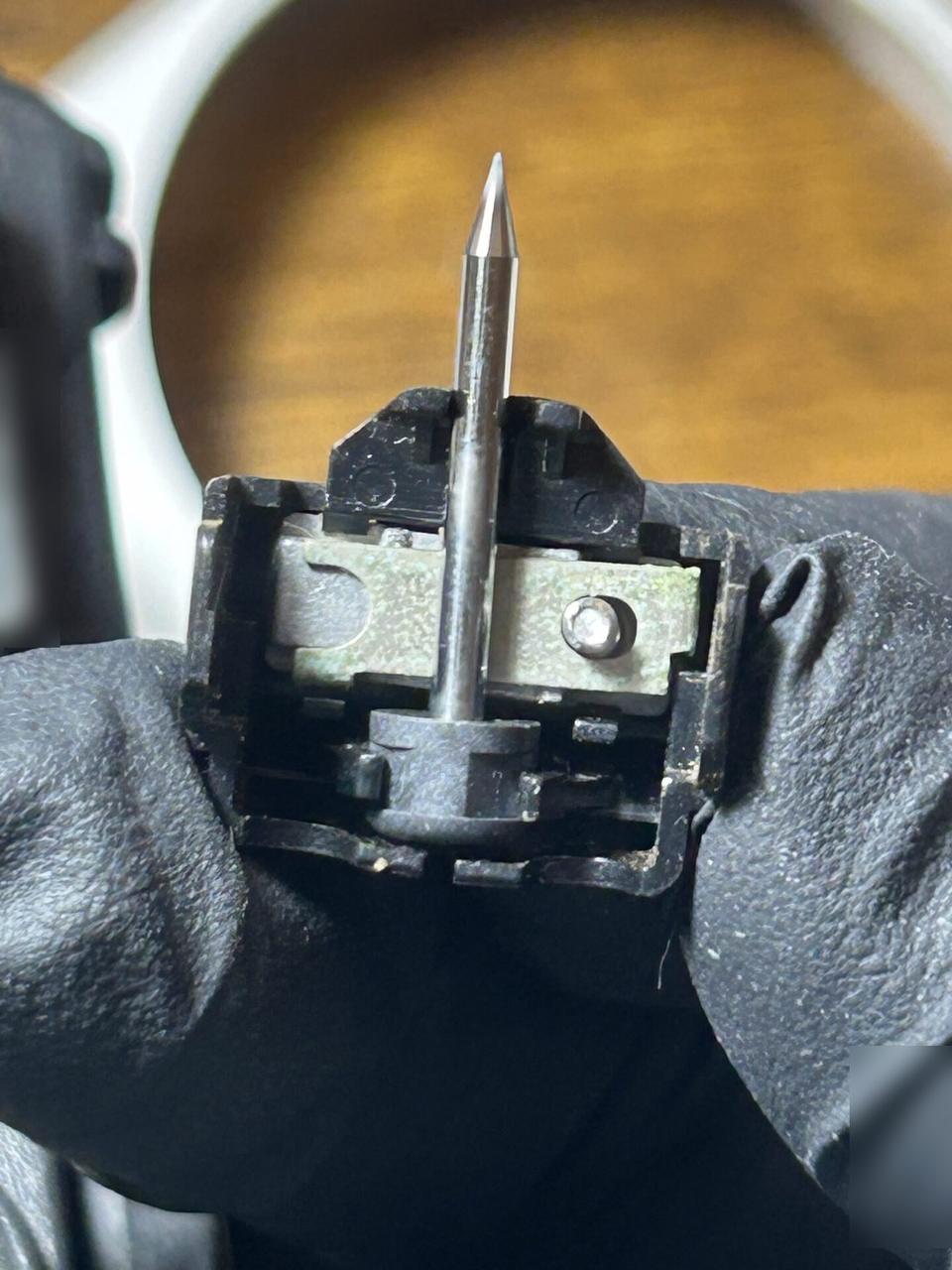 Alrty field photo with fiber optic cable and service handoff work with tools or ports visible