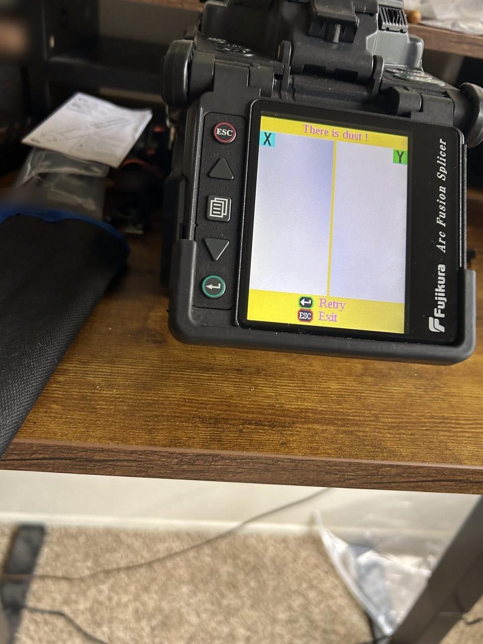 Fiber splicing and cable preparation detail with tools or ports visible documented for a smart technology service call