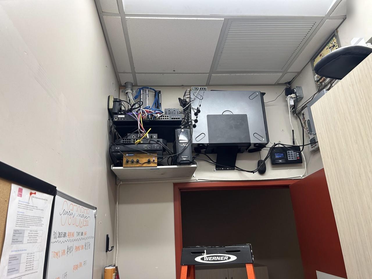 Alrty field photo with structured cabling inside a network rack with private labels omitted