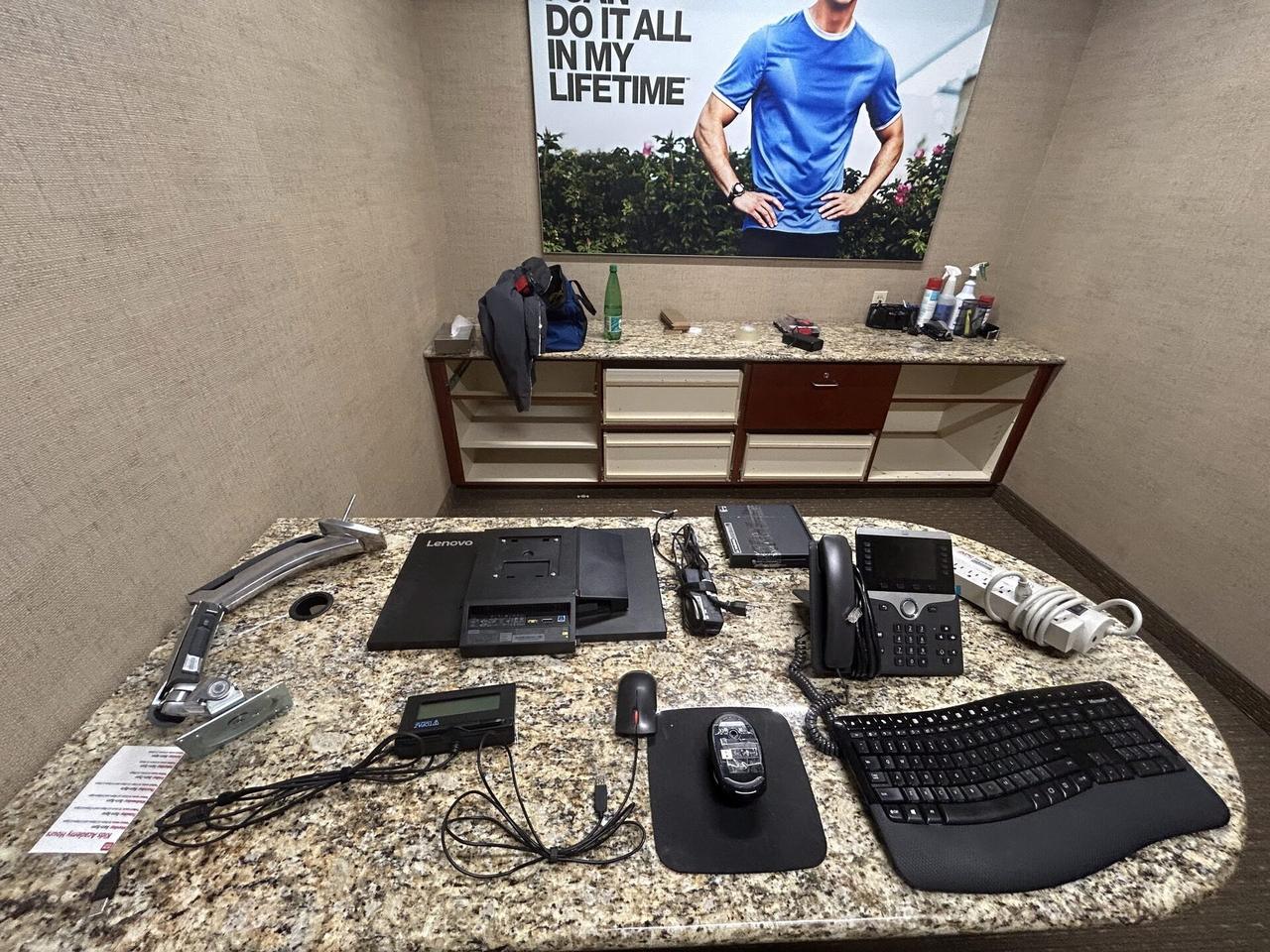 Office workstation setup with monitors with peripherals in service context during an Alrty onsite service visit