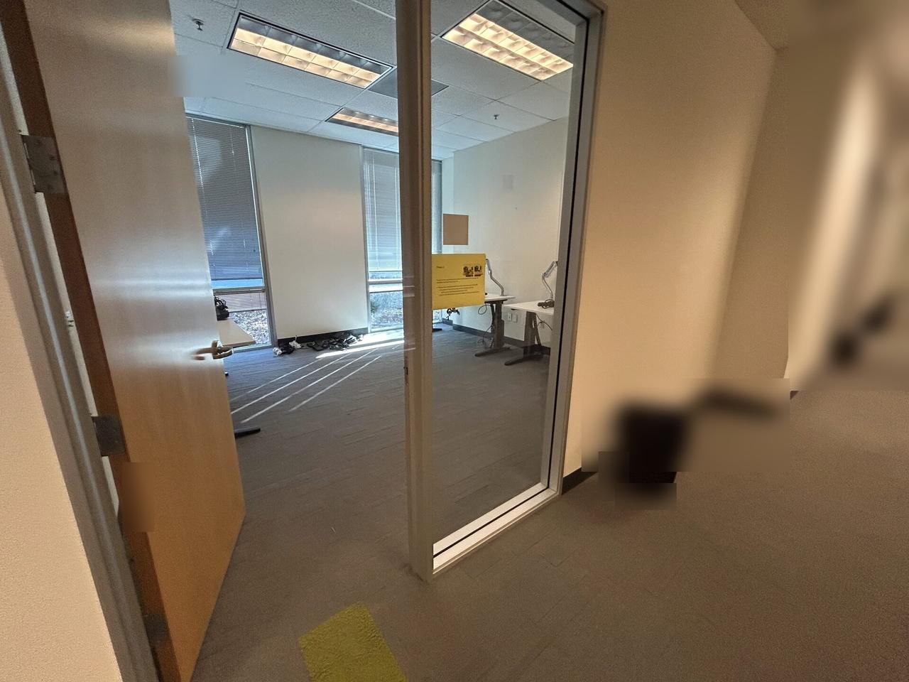 Alrty portfolio view of desk-side workstation setup during onsite service with private screen details omitted