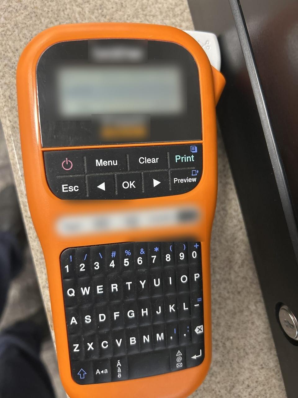 Alrty field photo with label printer used for cable and device labeling