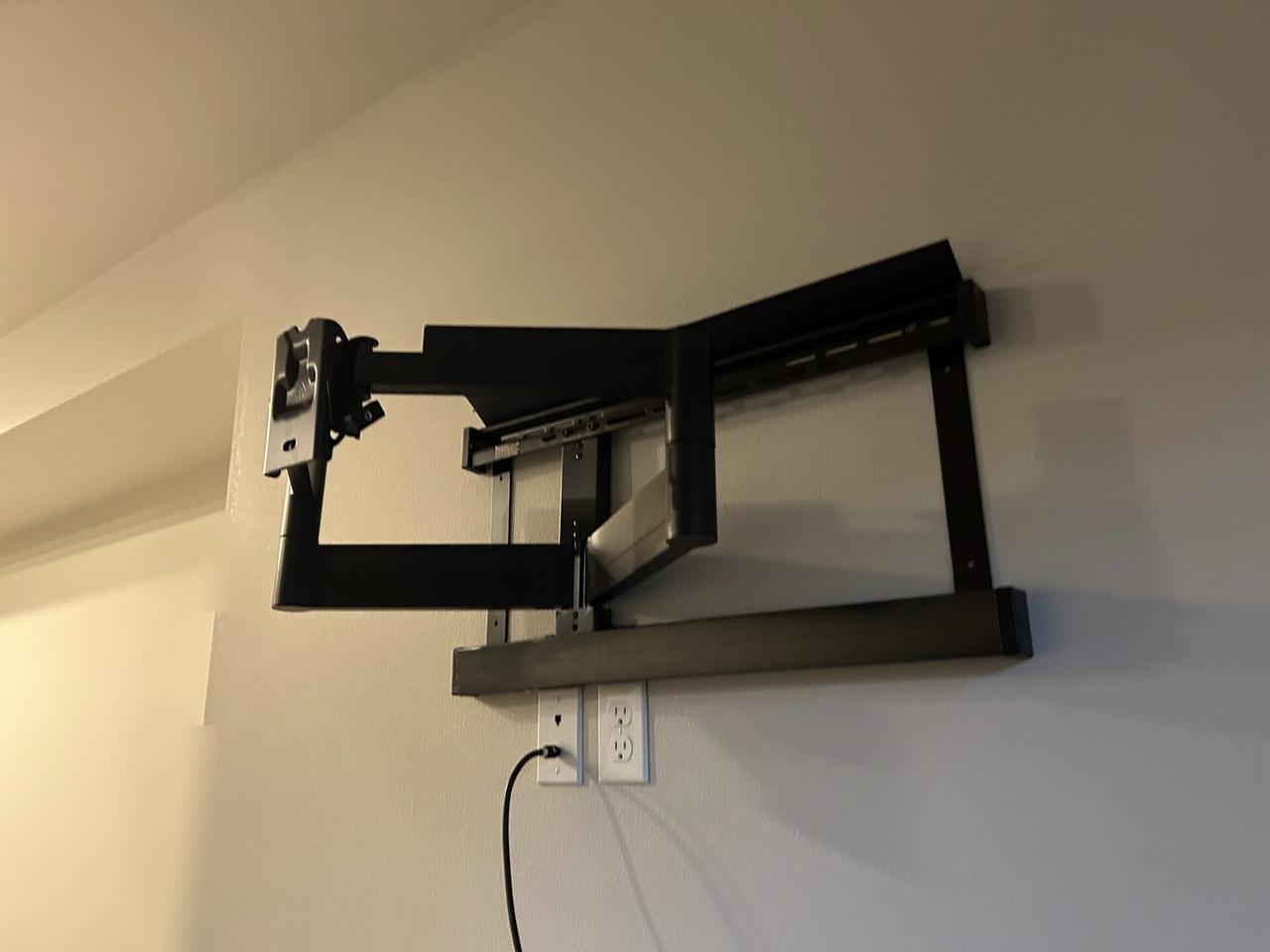 Alrty field photo with home theater cabling and display service detail during display setup