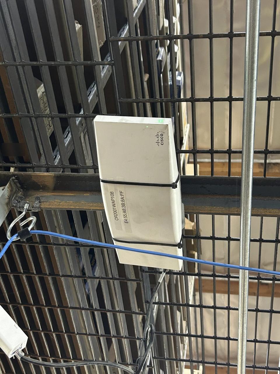 Service documentation showing enterprise retail wireless access point refresh with cable routing visible