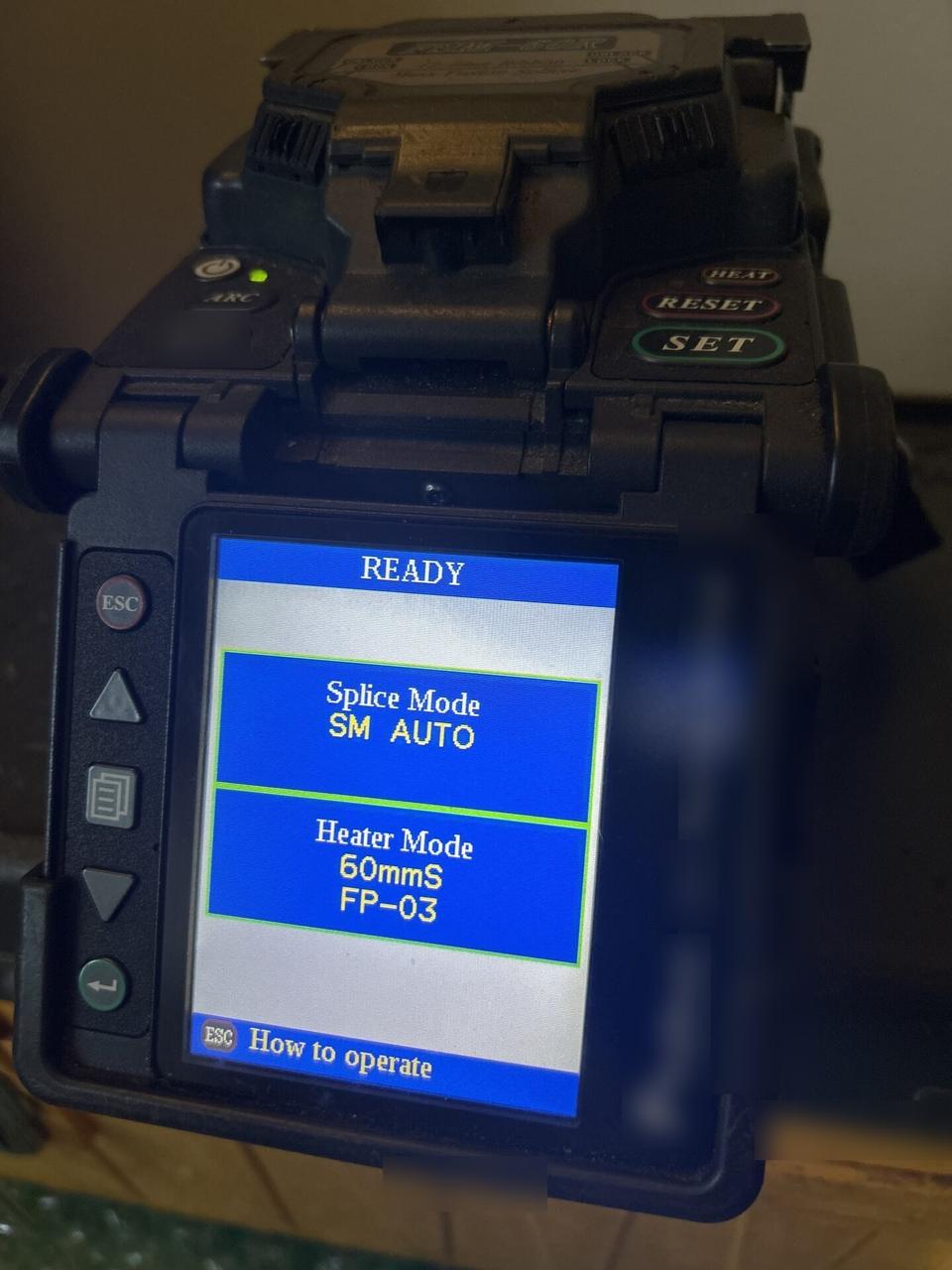 Onsite service photo showing fiber splicer settings screen