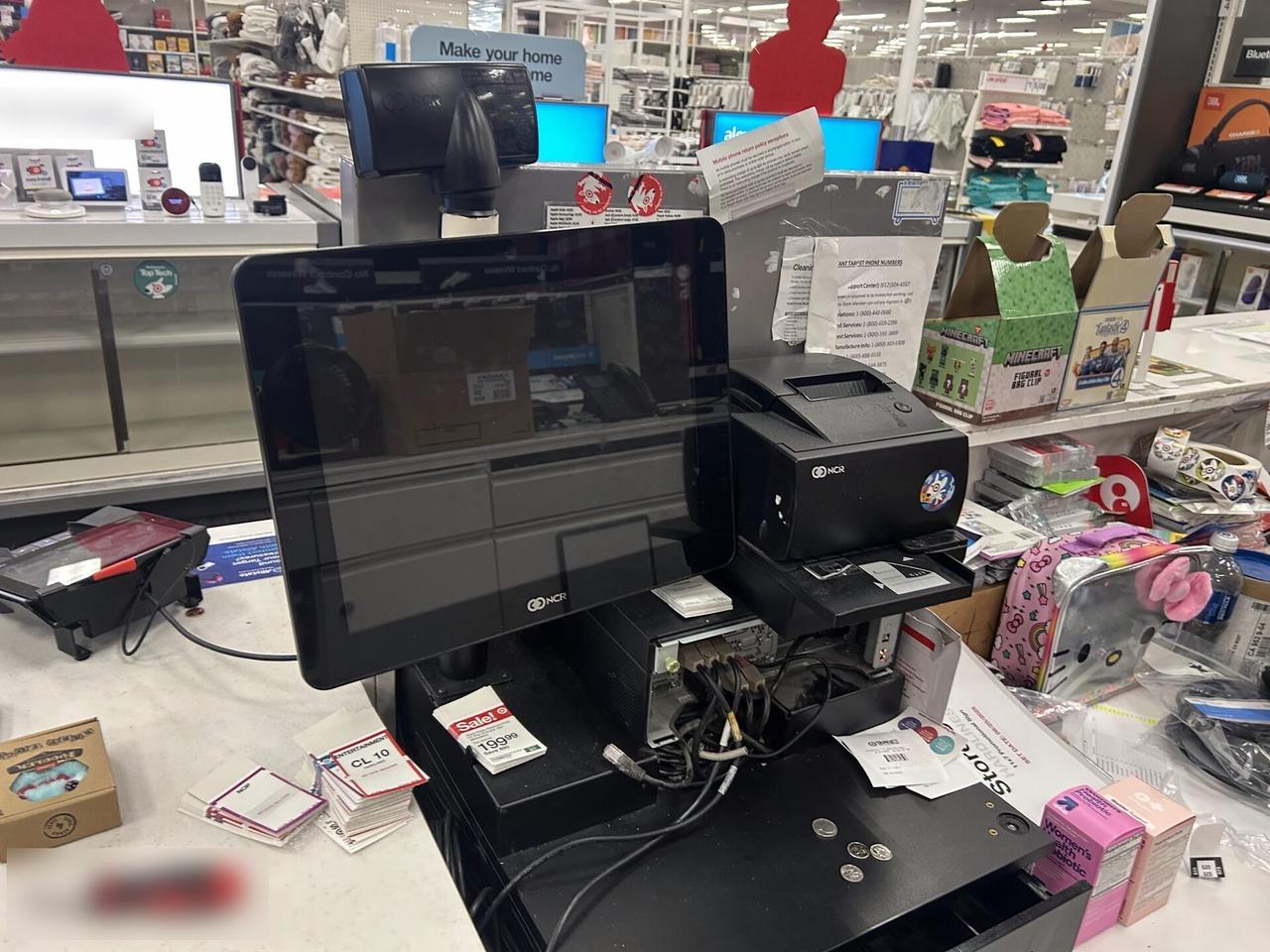 Service documentation showing checkout station POS hardware at the checkout counter