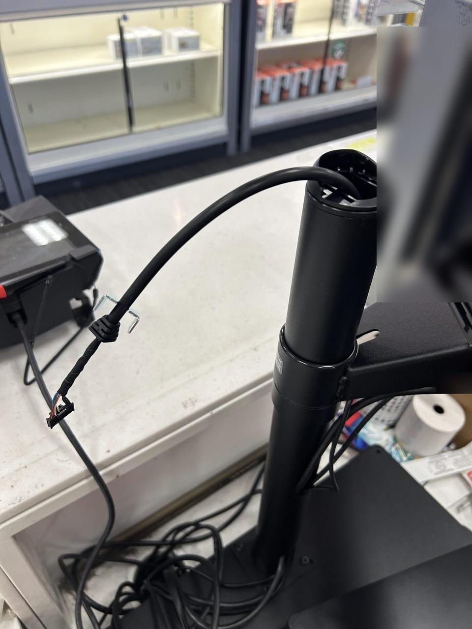 Onsite service photo showing checkout station POS hardware during retail support