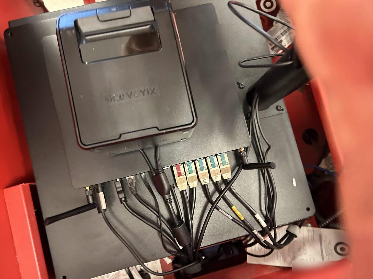 Onsite service photo showing checkout station POS hardware during register setup