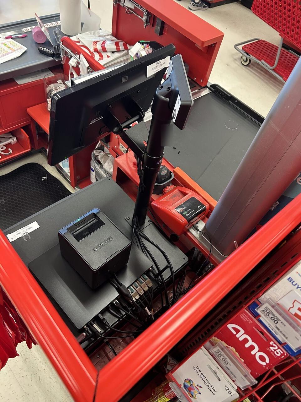 Checkout station POS hardware at a checkout lane during an Alrty onsite service visit