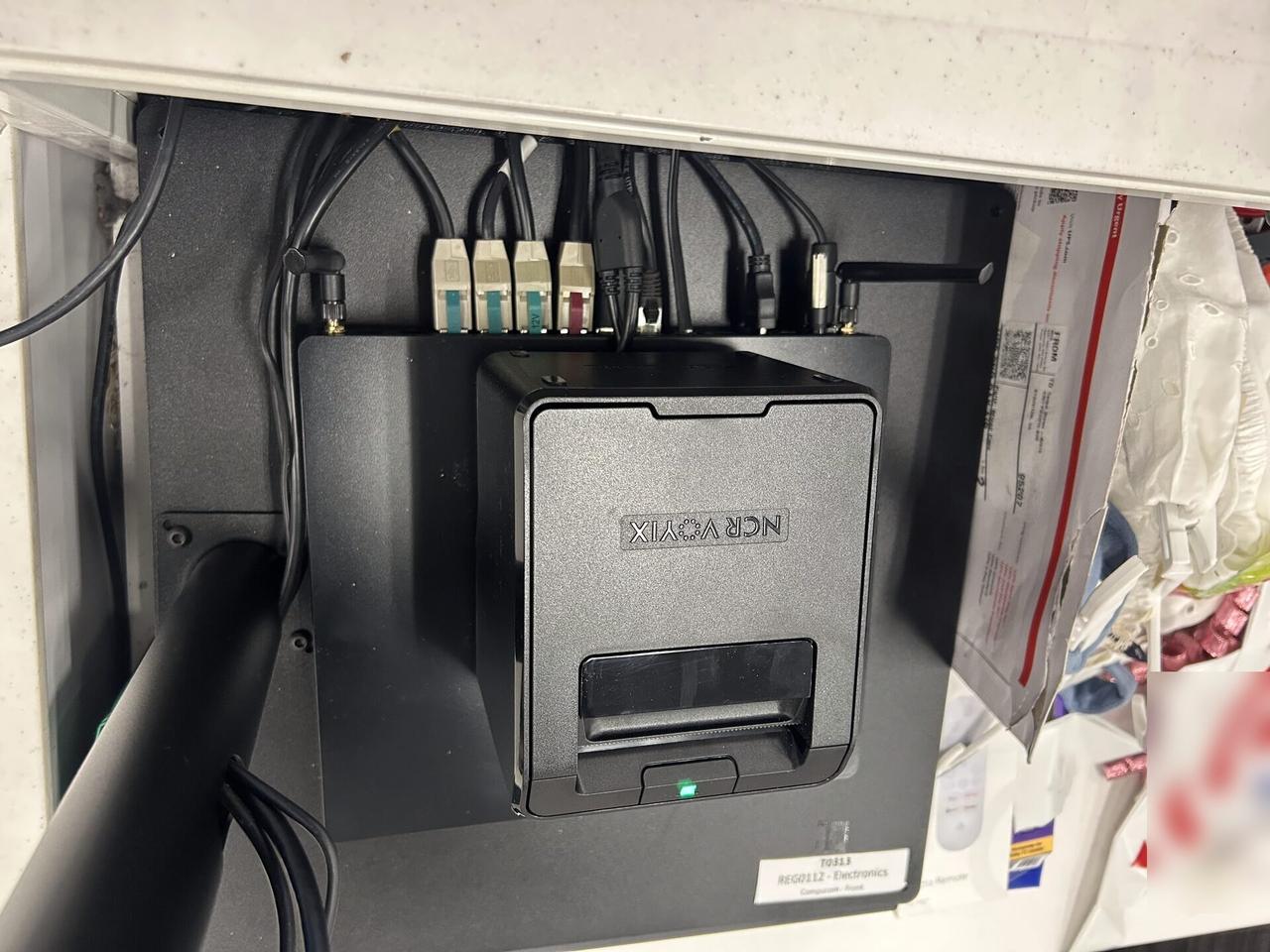 Public-safe portfolio image of checkout station POS hardware during retail support