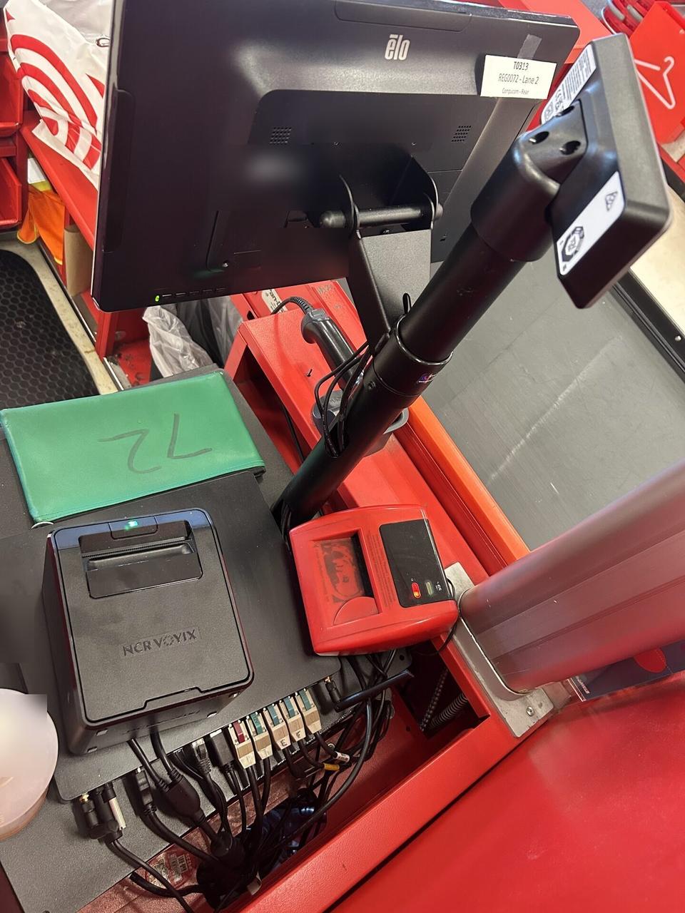 Onsite service photo showing retail checkout work area with POS terminal hardware