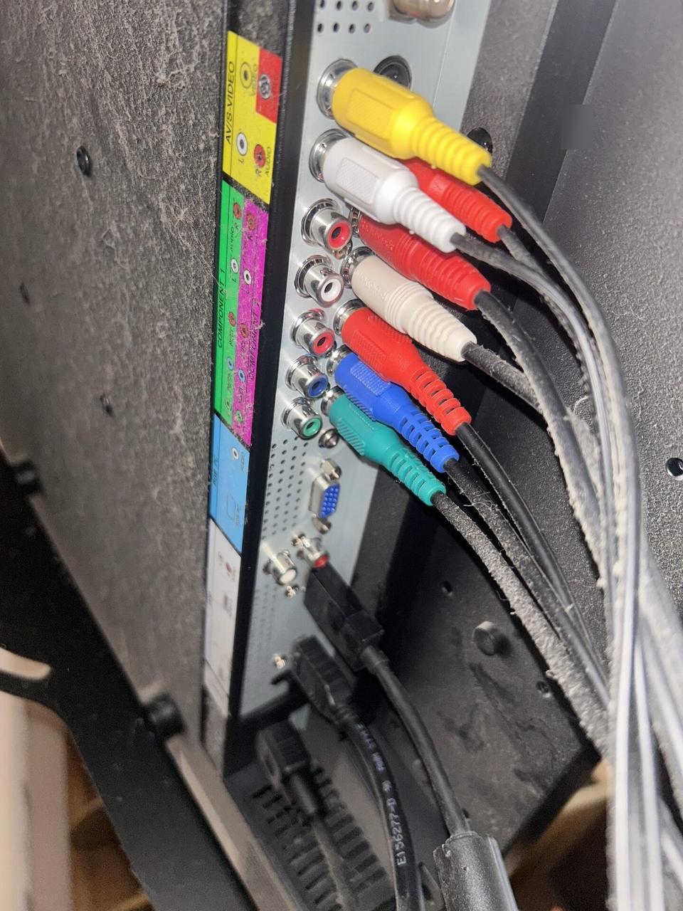 TV mounting or home theater setup detail with display placement, mount work, cabling or finished installation context