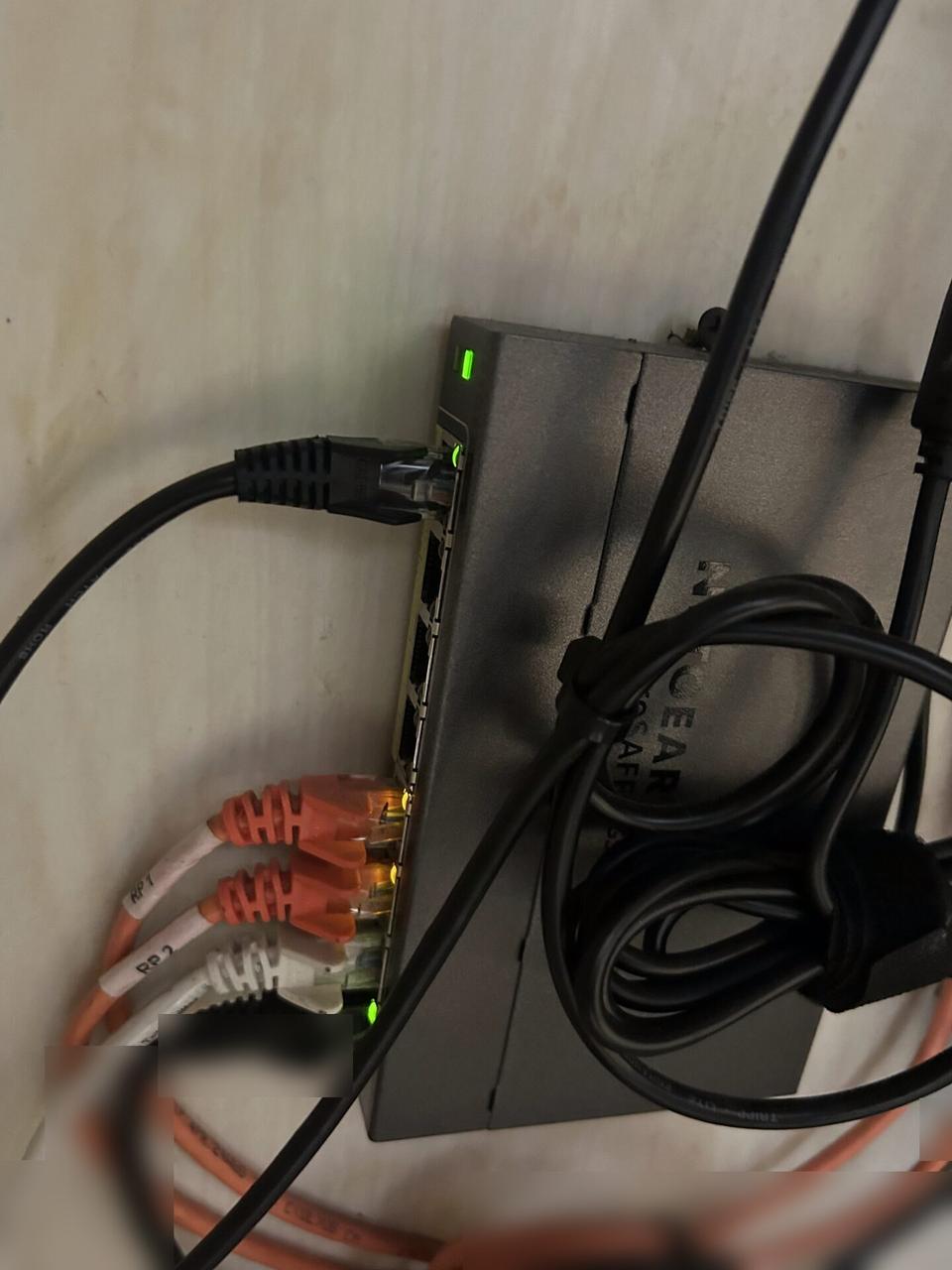 Service documentation showing low-voltage hardware and device cabling during field wiring work