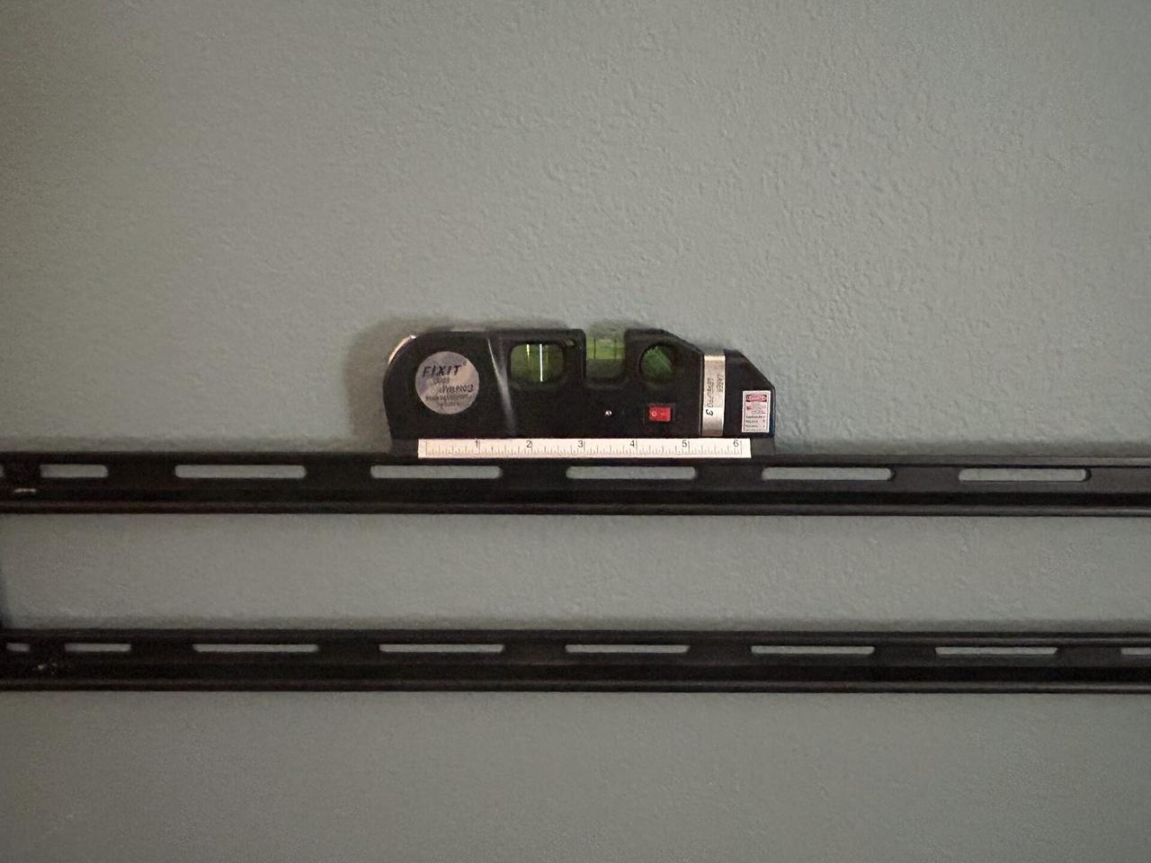 Display bracket or mounting preparation onsite for home theater support documented for a smart technology service call