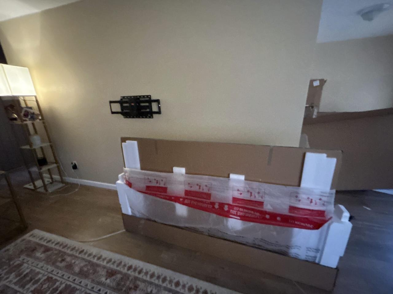 TV mounting and display setup work with private room details omitted documented for a smart technology service call