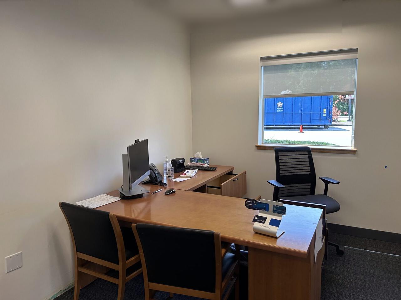 Alrty portfolio view of desk-side workstation setup during onsite service with monitor cabling visible
