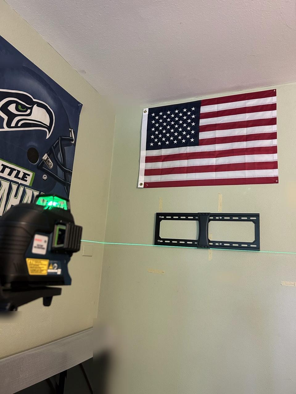 Public-safe portfolio image of wall-mounted TV setup and cable routing for home theater support