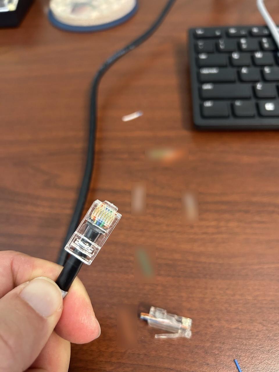 Onsite service photo showing cable path and connector work at the service location with private labels omitted